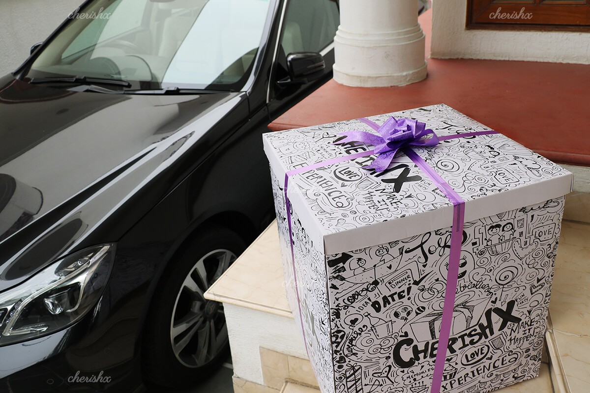 CherishX's surprise box packed with a purple ribbon.