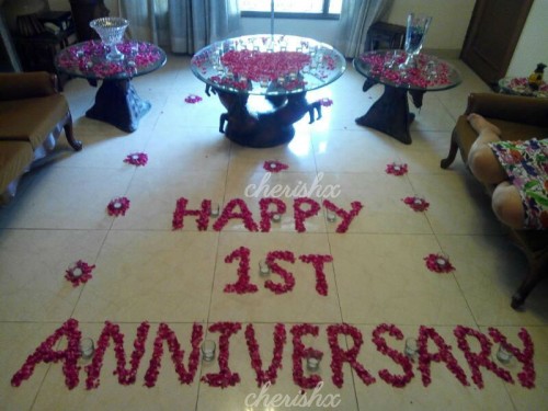 Wish anniversary to your wife or husband with a movie surprise with this loving rose petal decor.