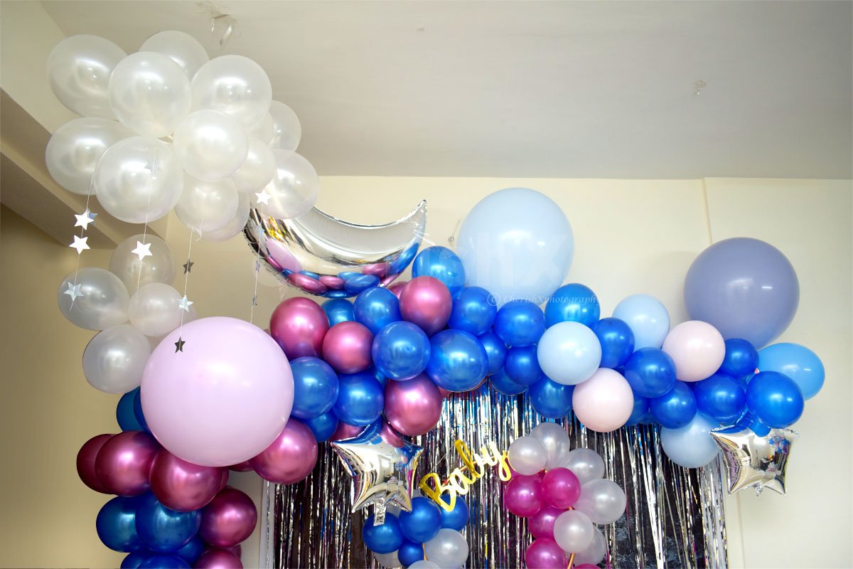 Exclusive Royal Baby Shower Decor with colourful balloons including blue, pink and white chrome and metallic balloons.