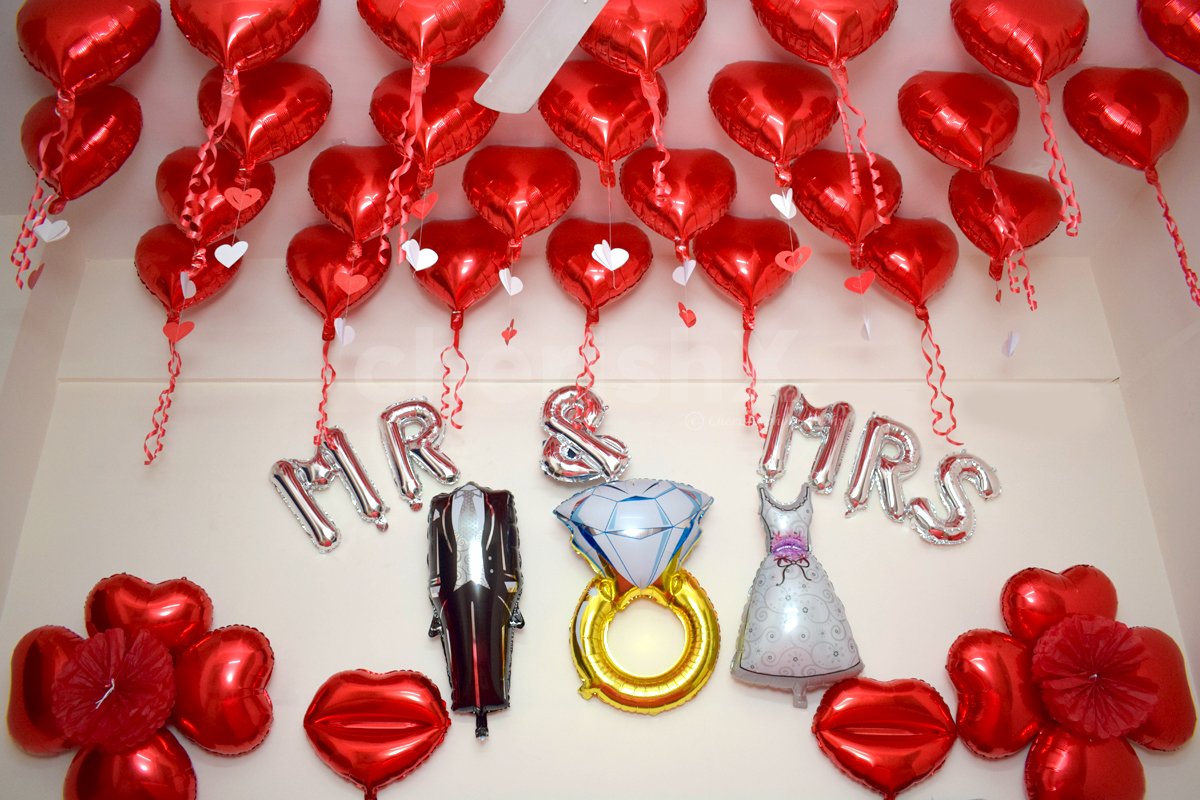 First Night Wedding Decor includes Red Heart-shaped balloons to give a romantic feel.