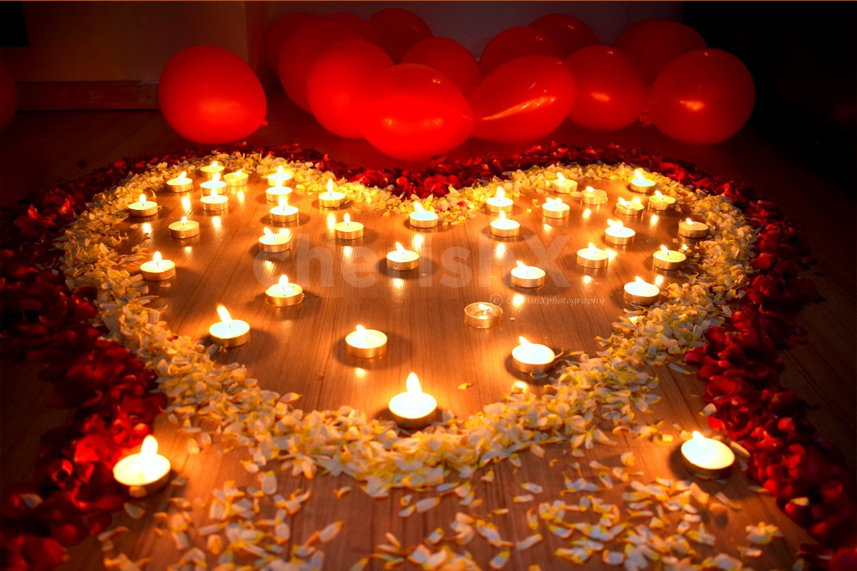 Added Heart made of Flower petals and candles to surprise your partner.