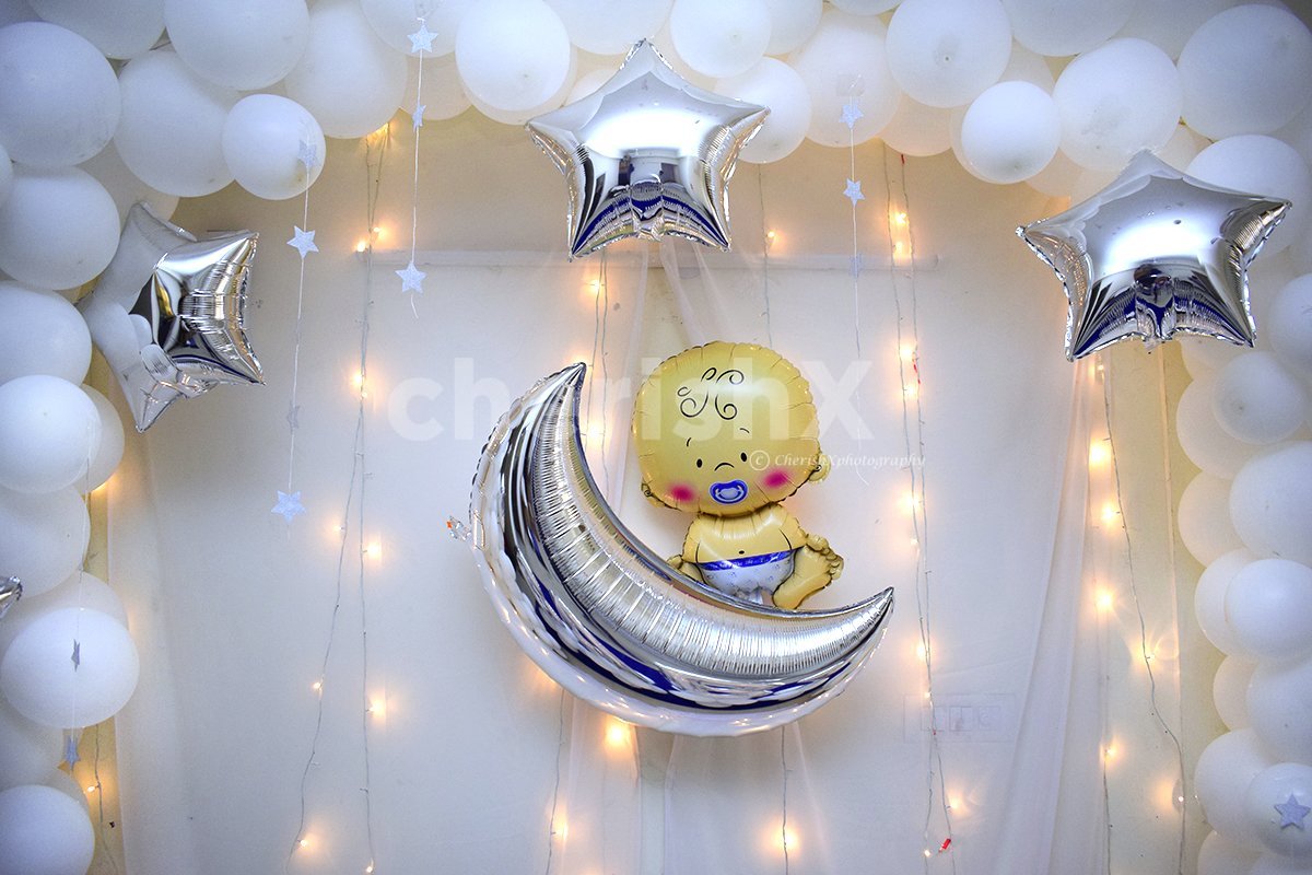 Baby Face Foil Balloon with a moon foil balloon to add elegance to the decor