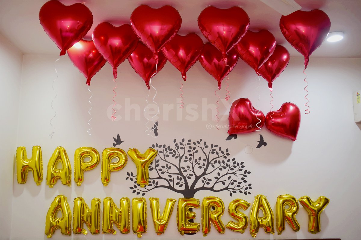 Happy Anniversary Foil Balloons and Heart-shaped foil Balloons used for making the decor romantic.