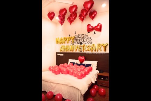 Happy Anniversary Foil Balloons and Heart-shaped foil Balloons used for making the decor romantic.