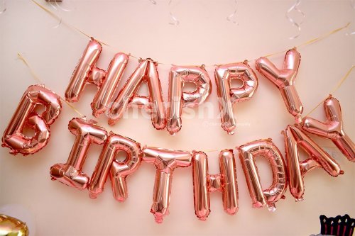 Wall decoration with Pink "Happy Birthday" Foil Balloons.