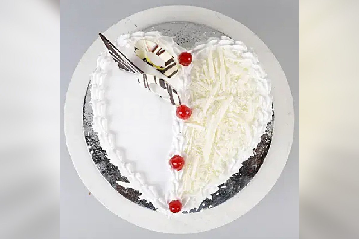 Home delivery of white forest heart shape cake