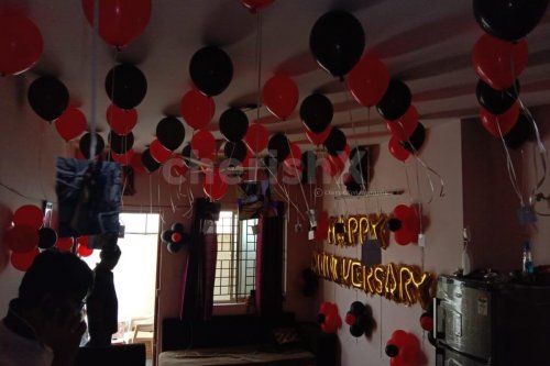 Red and Black Balloon Theme used for Anniversary Special Balloon Room Decoration.