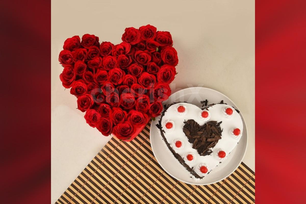 50 Red roses heart arrangement and a heart shape black forest cake