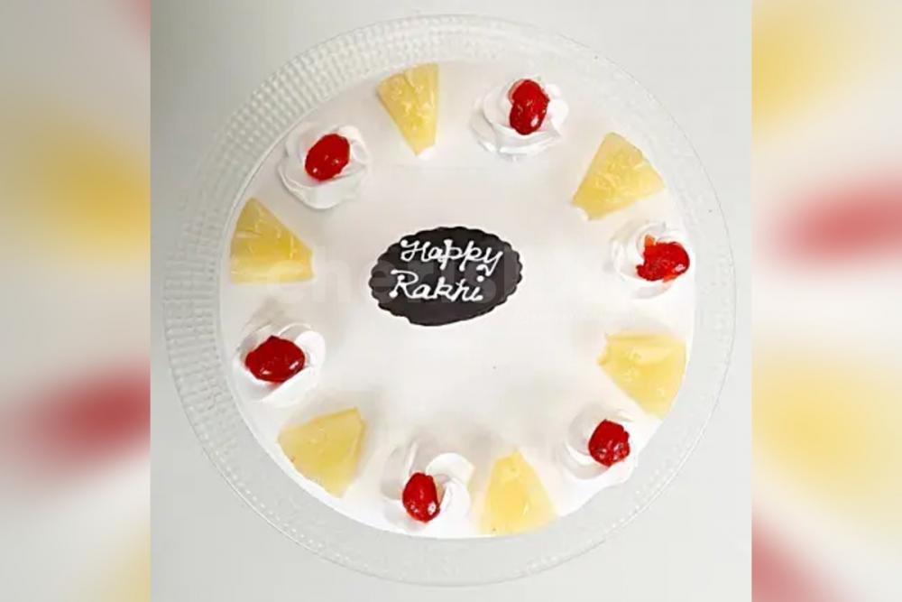 Rakhi and pineapple cake home delivery by cherishx