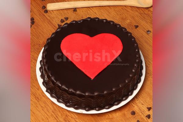 Truffle cake with a heart and roses combo home delivery by cherishx