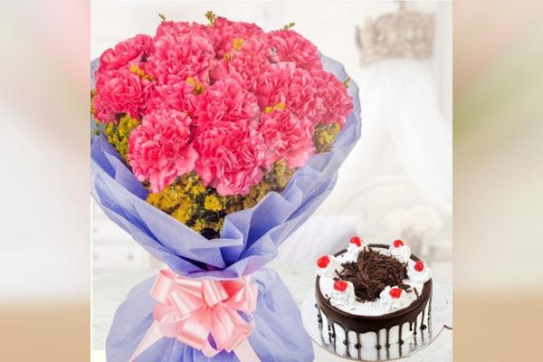 Pink carnations with blackforest cake