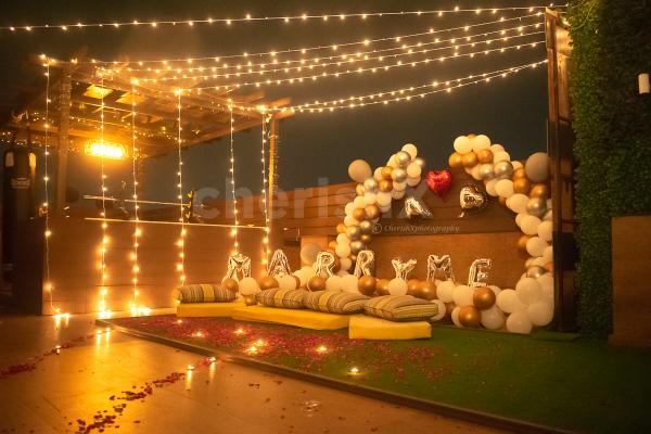 Fairy Lights on the Rooftop with Balloons and Arcs