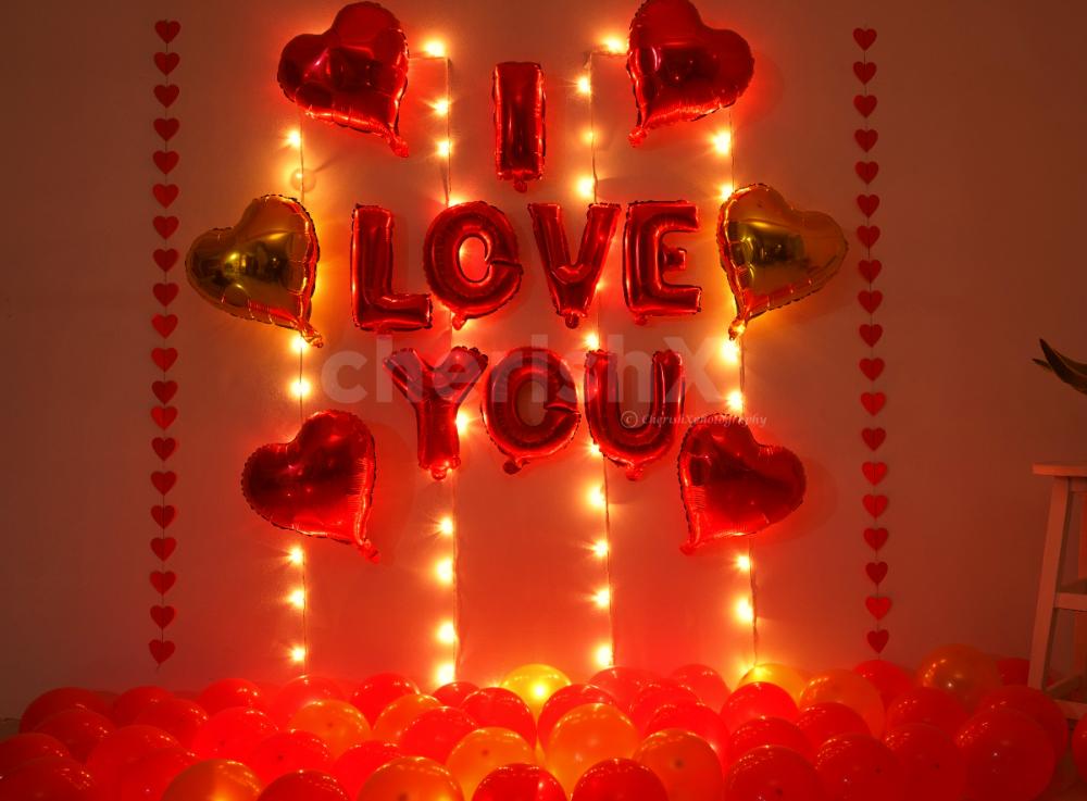 Romantic Balloon Decoration with I LOVE YOU foil balloons, heart shaped foil balloons and fairy lights