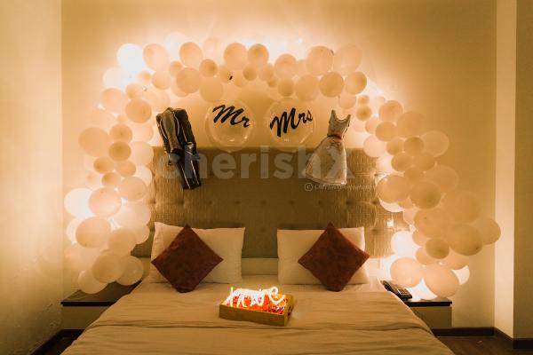 Celebrate your first night by surprising your partner with beautiful white theme decor offered by CherishX!!