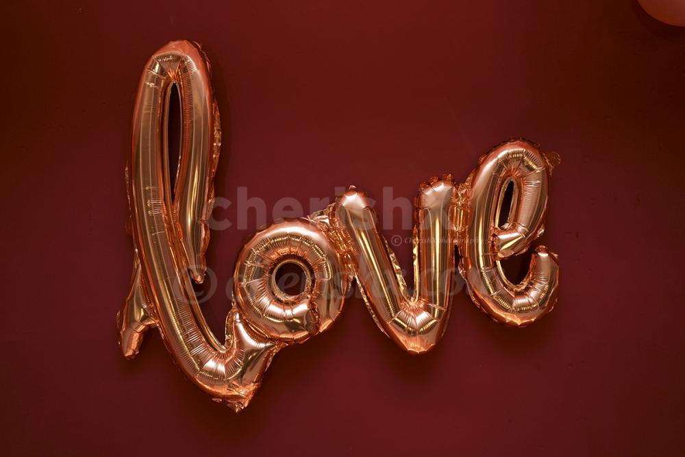 cursive love balloon in rosegold color