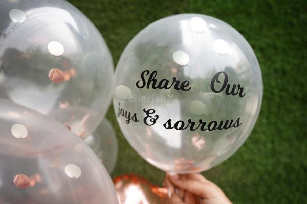 One of the 7 balloons with the promise "share our joys and sorrows".