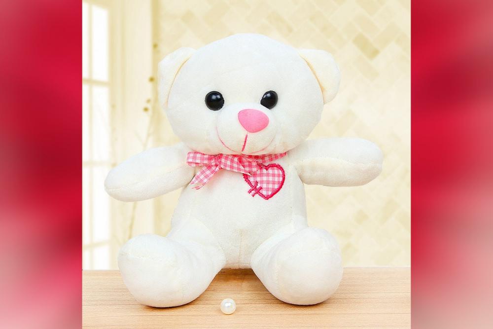 A cute teddy bear of white colour.