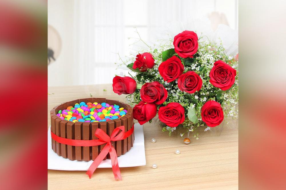 A combo of red roses and Kitkat gems cake.