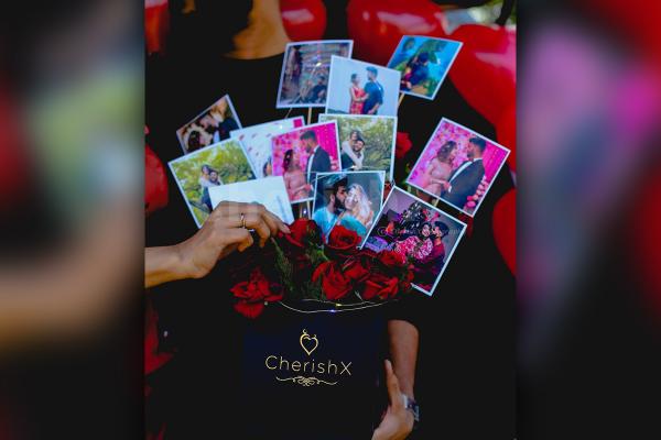 Beautiful photos set up in the bucket with roses to give a wonderful look to the gift.