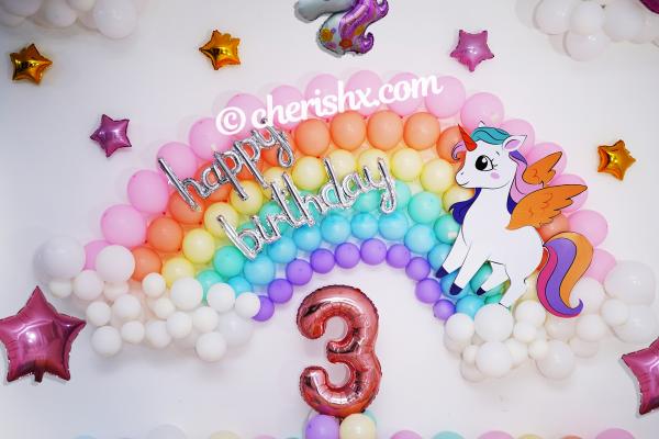 Throw a party to celebrate your child's birthday with colourful unicorn balloon decoration.