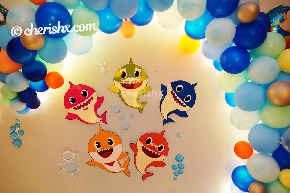 Baby Shark Paper Cut-outs and Balloon arc to enhance the Room Decoration.