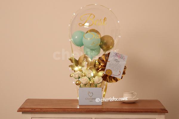 A wonderful bucket filled with balloons to gift to your sister on Rakhi!