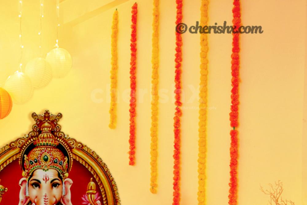 Garlands hanging from the ceiling for decorting the walls of the home for Ganesh Chaturthi!