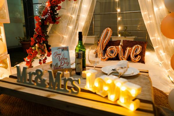 The Canopy Proposal Experience includes an Easel Stand with "Will You Marry Me" text Easel Board (2x2ft) decorated with Led Lights.