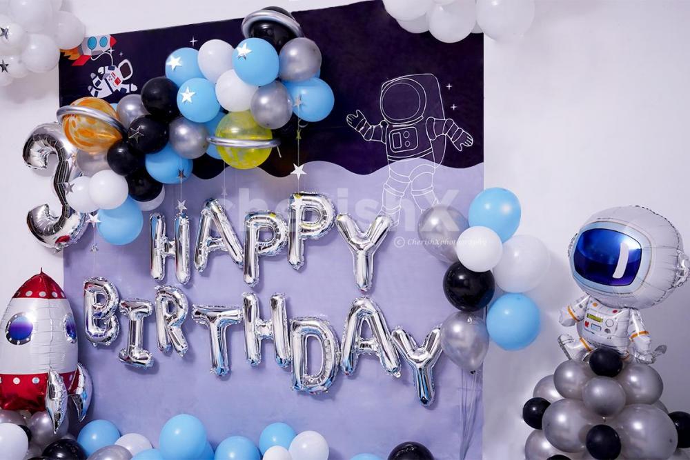 Celebrate your kid's birthday with this adorable Space themed birthday room decor.