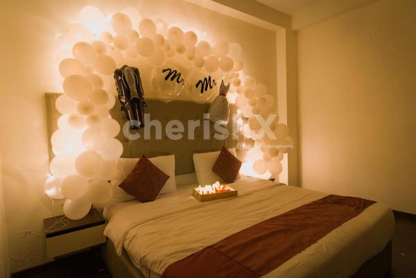 Book CherishX's White Themed Premium First Night Wedding Decor for a lovely night.