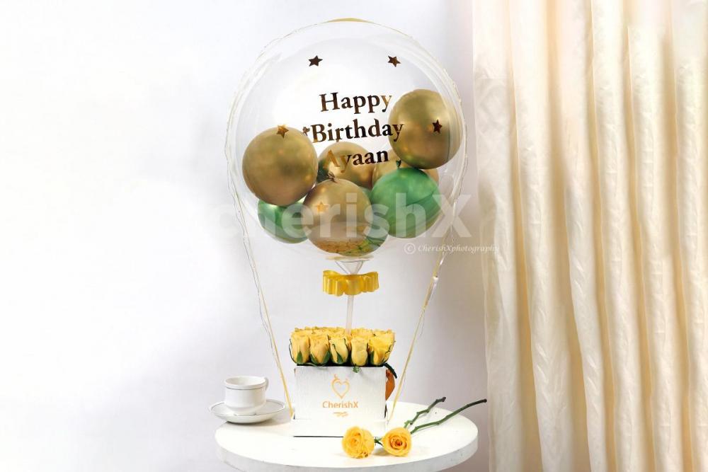 Send wishes with this extraordinary Gold & Green Balloon Bucket with Chocolates!