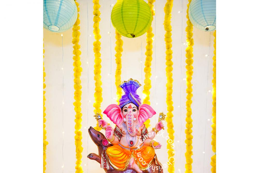 Get a Ganpati Marigold Decor at your home with CherishX.
