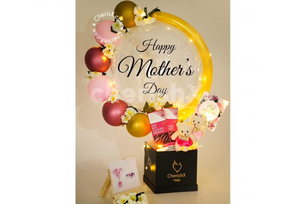 Make the Celebration much more special for your mom with CherishX's Mother's Day Pink Tint Balloon Bucket!