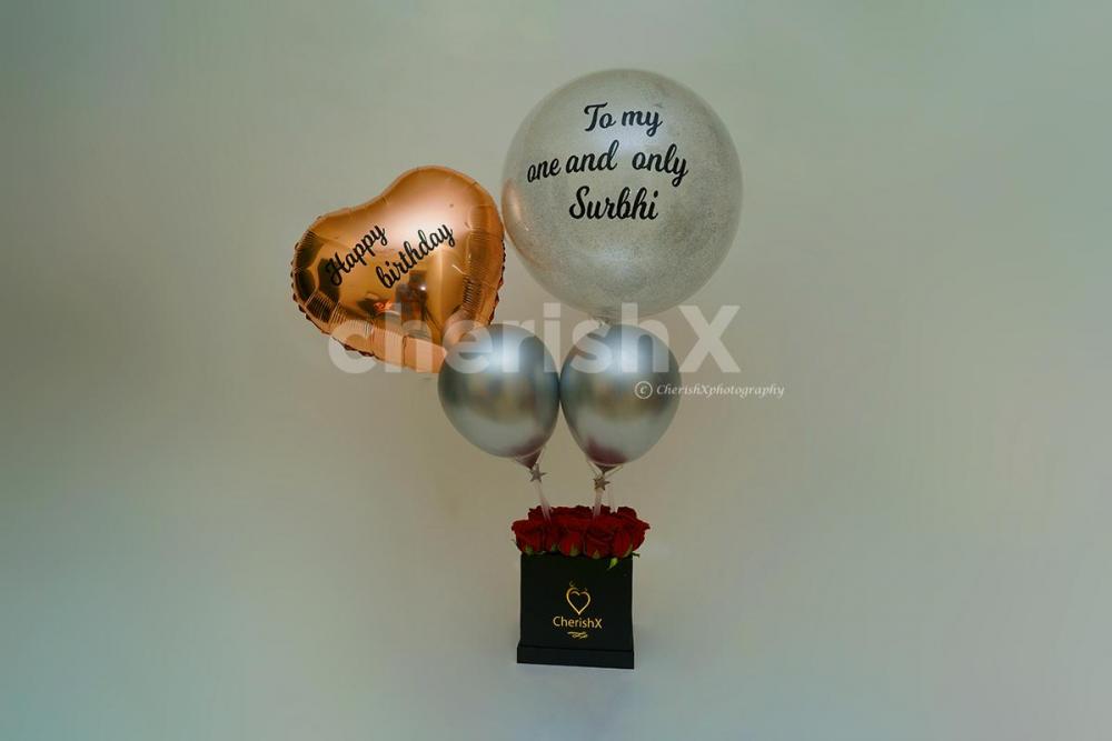 Book this elegant rosegold and chrome balloon rose bucket to your loved ones from cherishx