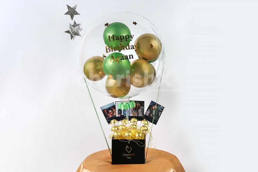 Embrace the moments of your loved one's birthday by gifting this Gold & Green Balloon Bucket with Chocolates!