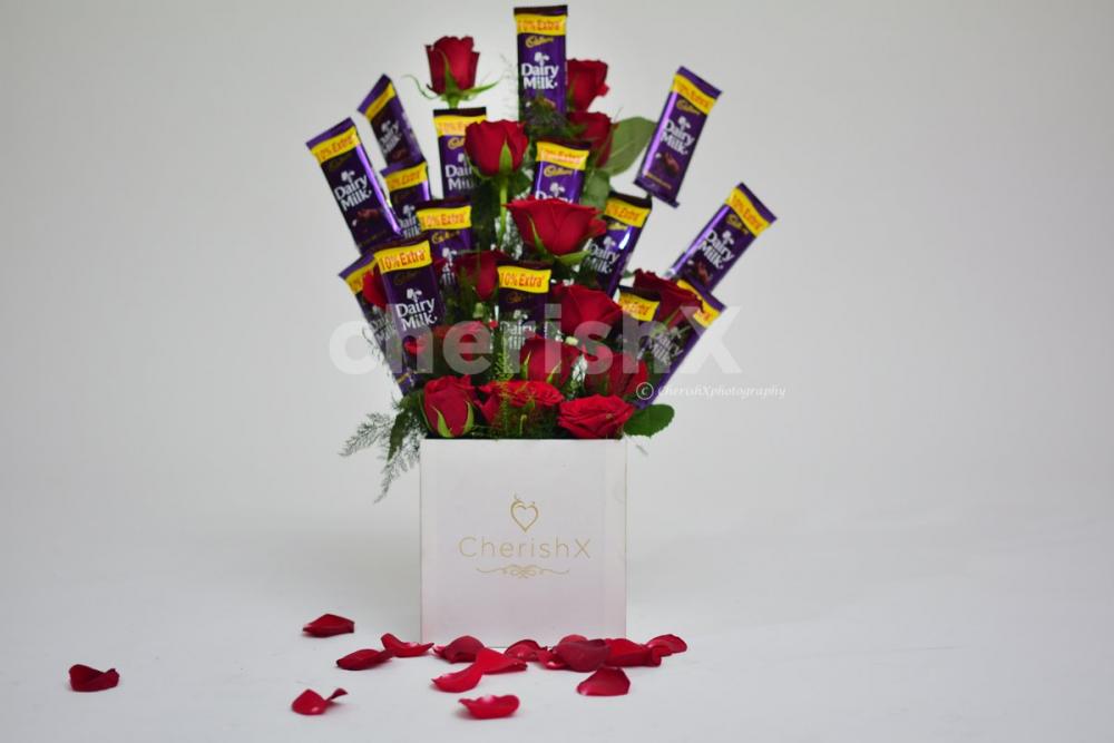 CherishX offers you a charming Rose bucket with chocolates to make his/her day.