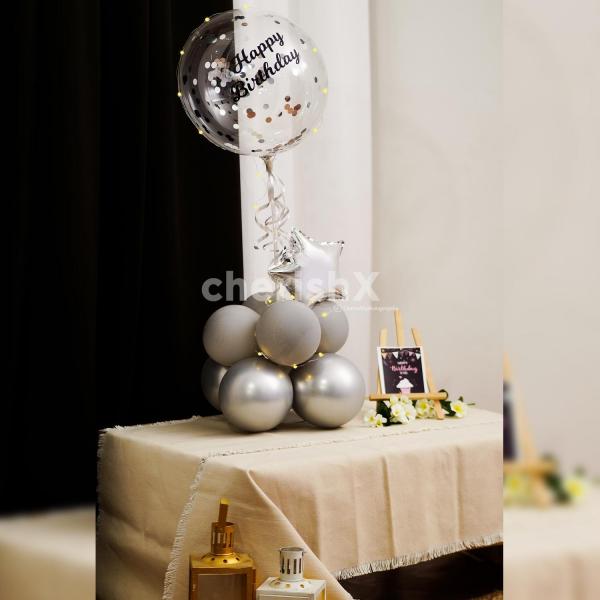 Have an elegant celebration with this sophisticated Grey and Silver balloon bouquet.