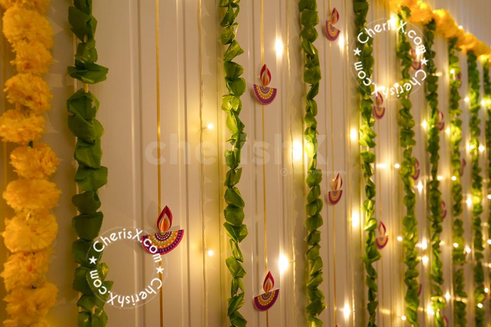 Celebrate the Diwali festival with diyas, garlands, and lights.