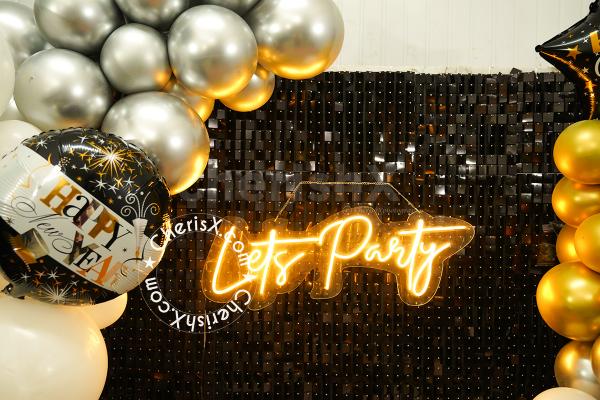 The black sequin backdrop will add brightness to your new year's night