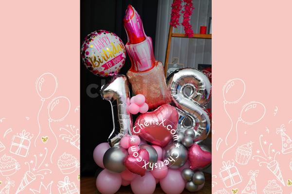 Make it extra festive with a balloon bouquet in pink and silver.