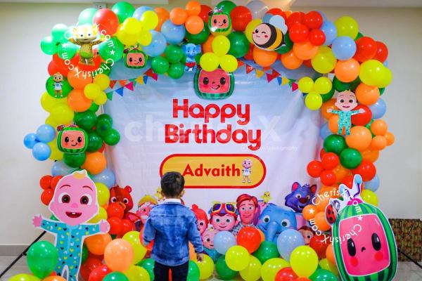 2. CherishX's Cocomelon Themed Kid's Birthday Decor includes colourful balloons and themed cut-outs