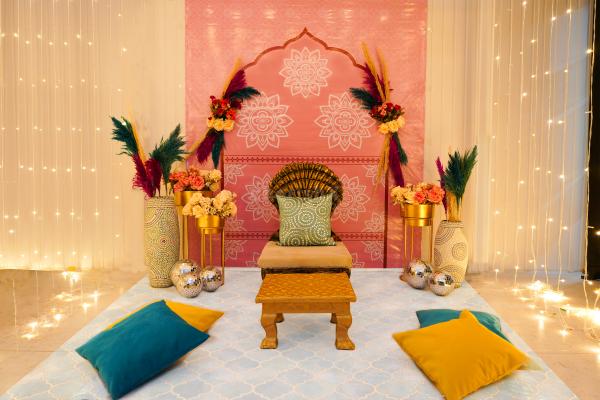 The pink and white textured colours on the backdrop are perfect for the Haldi and Mehndi ceremonies