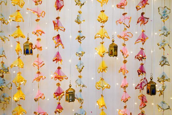 The artificial yellow garlands draped with pixel lights make it an attractive backdrop