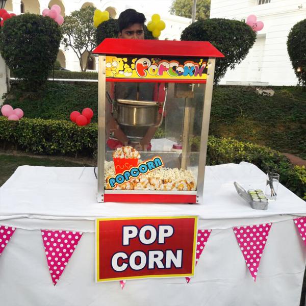 A popcorn counter provides a fun and tasty snack option at their birthday party