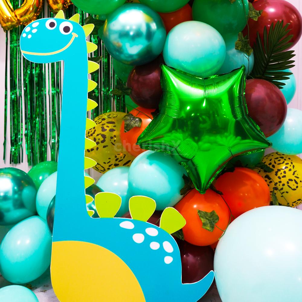 Celebrate another birthday year with dinosaur decor in green