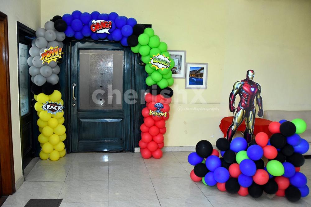 A Black Panther Cut-out stand on a colourful balloon bunch.