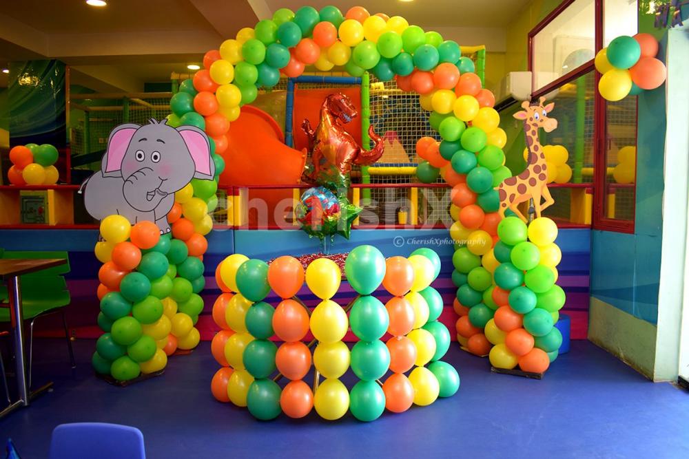 A dome-like structure made up of balloons with different colours to make the decor look attractive.
