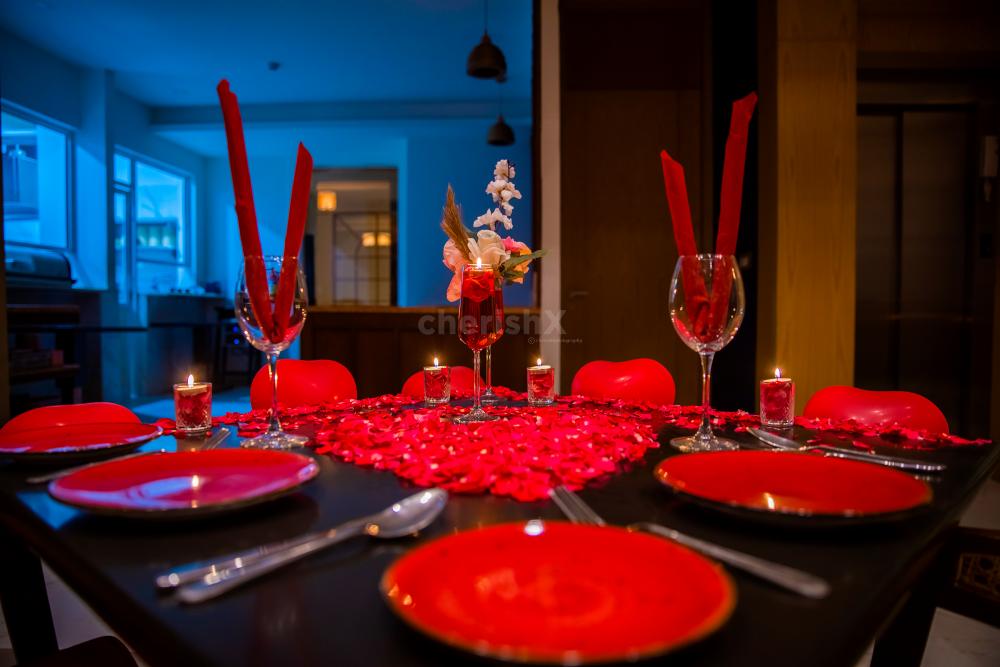 The dim light created by the candles sets the mood for a romantic and intimate evening