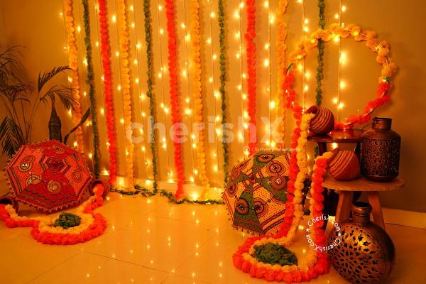 A Festive Umbrella and Flower Garlands Decor curated especially for your Diwali Celebrations!
