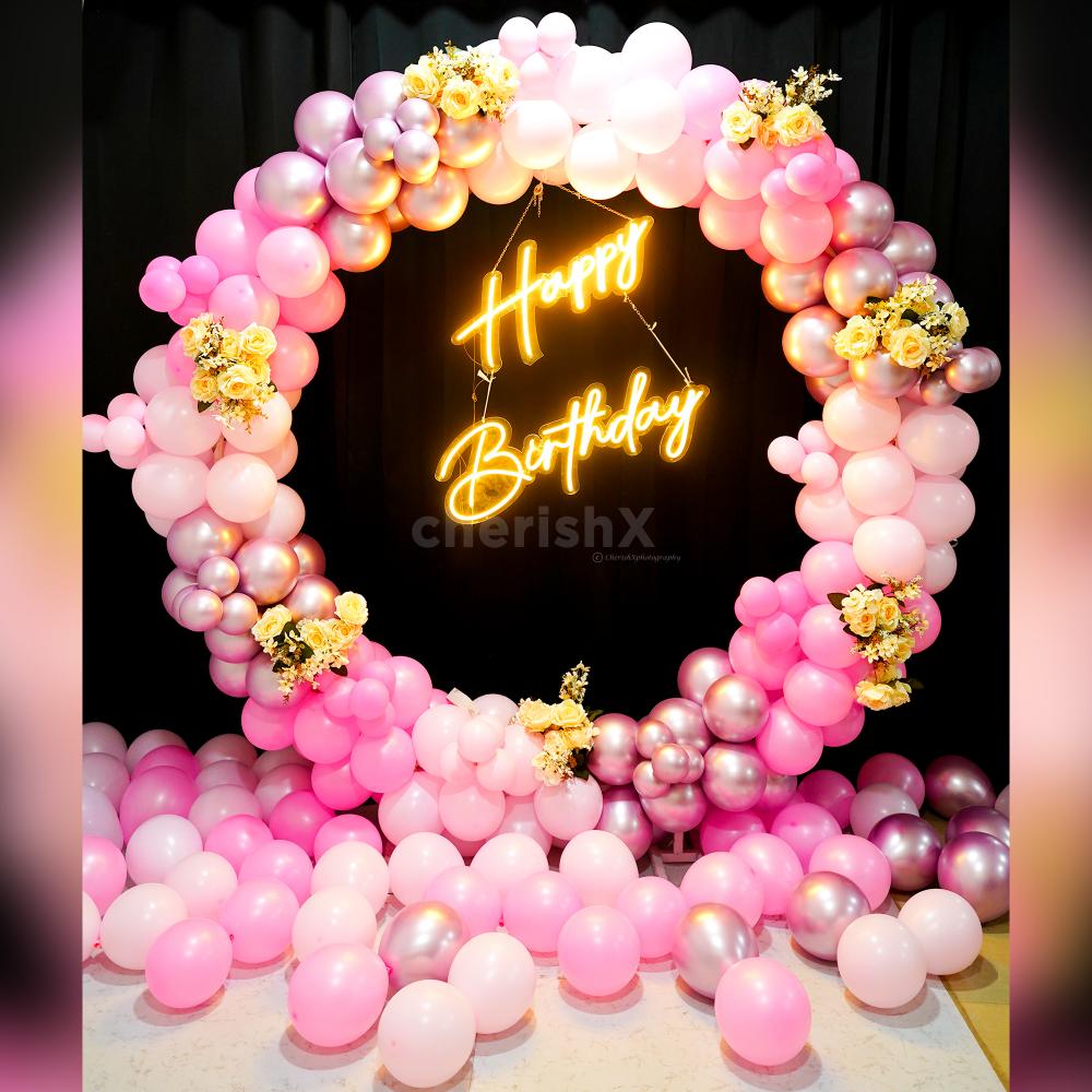 Get a 'Happy Birthday' Neon Light Sign with Pink Balloon Arch.